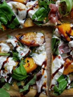 a pizza topped with lots of toppings on top of a wooden cutting board