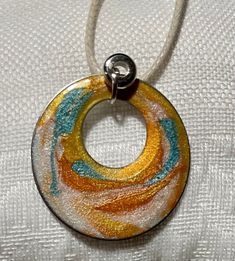 One-of-a-kind necklace made of solid stainless steel with vibrant mica powder colors mixed with clear glass resin. Pendant on a beautiful 18 inch white leather cord with clasp. Modern Resin Jewelry For Gifts, Modern Resin Jewelry Gift, Artsy White Jewelry For Gifts, Adjustable Hand Painted Round Pendant Jewelry, Modern Hand Painted Multicolor Jewelry, Adjustable White Hand Painted Necklaces, Adjustable White Hand Painted Necklace, Hand Painted White Round Pendant Necklaces, Minimalist Silver Resin Jewelry