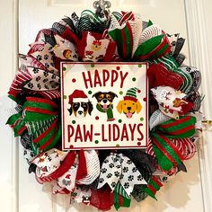 a happy paw - lid days wreath with dogs on it