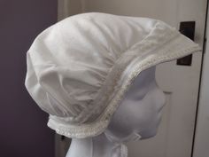 For your consideration is this cute Victorian era bonnet. Victorian ladies would go to sleep wearing a nightcap or sleeping cap.  While they were very pretty and elegant, it was for the hairs benefit more than anything as it kept their long locks tangle free and healthy. Please click +More for full listing info. Bonnet measurements are approximate: Bonnets brim is 22" circumference.   Each tie measures 19"L Entire back length is approx. 15"" L Head circumference 22" (or less) Night cap is recreated using a actual historic pattern from 1883!!  The style shown is authentic and accurate!!  Very popular among the ladies of the time. Nightcap is of a lovely white cotton . Decorated in a vintage lace trim with white satin ribbon stitched on.  Another more modern satin ribbon cord trim adorns the Bonnet Victorian, Victorian Sleepwear, Night Hat, Sleeping Hat, Sleeping Cap, Sleep Hat, Victorian Accessories, Victorian Hats, Victorian Ladies