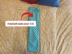 a bed with two pillows on top of it and an arrow pointing to fold left side over 13