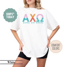 a woman wearing a white shirt with the word axq on it