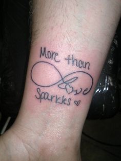 a wrist tattoo with the words more than sparkles written on it