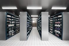 an empty pharmacy room with shelves full of medicine