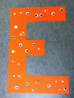 the letter e is made out of orange plastic