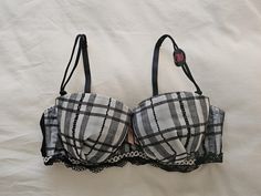 A NWT old stock Vintage Nylon and Lace Push Up Bra from Japan, in size 14A/Aus, 36A/UK and 36A/US, (Japanese C80) in a plaid/check chiffon finish on the cups with contrasting lace trim. Underwired and padded with elasticised, adjustable and removable straps and double clasp. Satin Bow between cups. Colour - Grey/Black Invisible Wardrobe, Vintage Bras, Grey Bra, Vintage Bra, Bra Items, Satin Bow, Bra Lingerie, Sewing Clothes, Push Up Bra