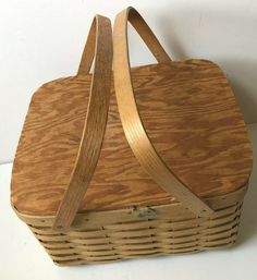 a wooden basket sitting on top of a table