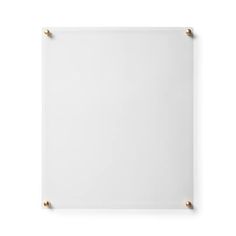 an empty white board with gold studs on the bottom and sides, isolated against a white background