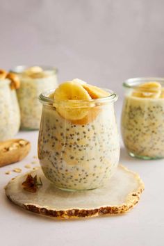 chia seed pudding in a glass jar with sliced bananas on top