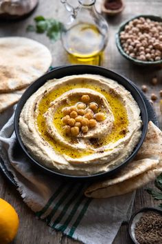 hummus with chickpeas and olives in a bowl