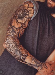 a man with a tattoo on his arm