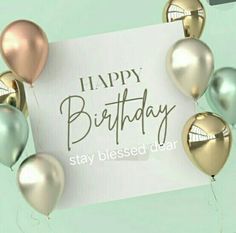 a happy birthday card with gold and silver balloons