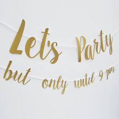 let's party but only until 9 pm sign hanging from string with gold foil lettering