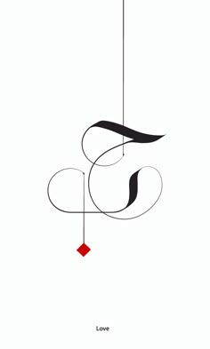 the letter s is hanging from a wire with a red square in it's center