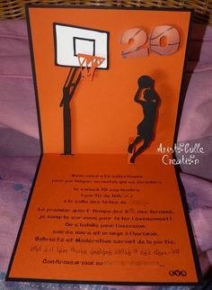 an orange card with a silhouette of a basketball player