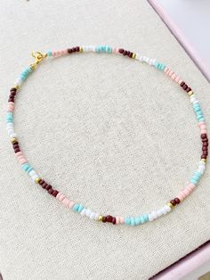 Seed Bead Choker Necklace 17 inches total length Perfect for layering with your favorites Glass Beads with Gold plated lobster clasp closure These little seed beads are 4mm wide A short extender tail will be added so you can adjust the length a little if you like Trendy Turquoise Beaded Necklaces With Round Beads, Trendy Turquoise Round Beaded Necklace, Pastel Beaded Necklaces With Round Beads, Pastel Beaded Necklaces With Colorful Beads As Gift, Pastel Beaded Necklaces With Colorful Beads For Gifts, Trendy Beaded Necklace With Colorful Turquoise Beads, Pastel Colorful Beads Necklace For Gift, Pastel Beaded Necklaces As Gift, Minimalist Beaded Necklace With Round Letter Beads