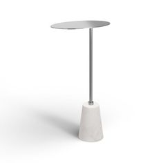 a white table with a round top and metal base