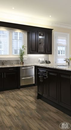 a kitchen with dark wood cabinets and stainless steel appliances