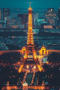 the eiffel tower lit up at night in paris, france with its lights on