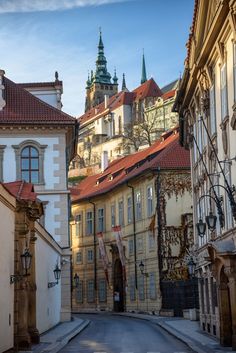 an old european city street lined with tall buildings