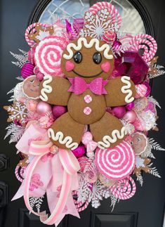 a wreath made to look like a gingerbread man is hanging on the front door