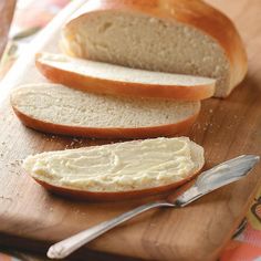 sliced bread and butter on a cutting board