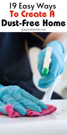 a person in blue gloves cleaning a table