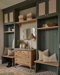 the instagram page shows an image of a living room with green cabinets and shelves