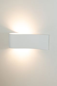 a white light that is on the side of a wall