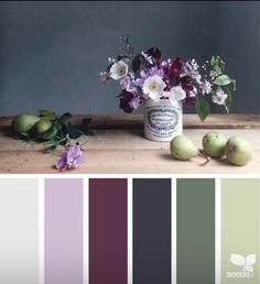 the color scheme is purple and green, with white flowers in a vase next to some apples