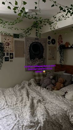 a bedroom with an unmade bed and plants hanging from the ceiling