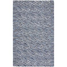 a blue and white rug with wavy lines