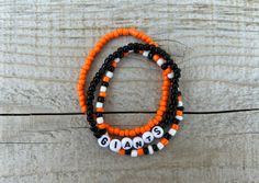 These Giants bracelets are the perfect way to show your team pride for the big game! Pair them with any outfit. This listing is for 3 bracelets as shown in pictures.  TO ORDER:  1. Pick bracelet length  2. Pick letter color 3. Submit and I'll get to work :)  PRODUCT DETAILS:  - Bracelets are made with sturdy jewelry elastic - Listing is for three bracelets  - All orders are final. Please double check your bracelet size  CARING TIPS:  - Do not expose jewelry to water  - Treat and store jewelry gently  - Roll bracelets on rather than stretching band to get on  Don't see your teams bracelets on our shop? Or have a custom team bracelet you want? Head to this link to order your custom ones!  https://kanaeohana.etsy.com/listing/1591607617/custom-sports-team-bracelets-team  We are HAPPY to do bul It Band Stretches, Team Bracelets, Baseball Bracelet, Giants Baseball, Sports Bracelet, Store Jewelry, Bracelet Beaded, Sports Baseball, Purse Charms