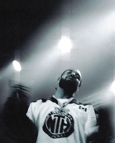 a man standing in front of some spotlights