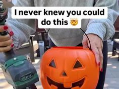 a woman holding a jack - o'- lantern with the words i never knew you could do this