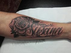 a person with a rose tattoo on their arm that says, awesome and in cursive writing