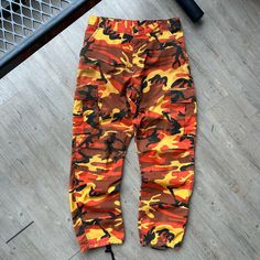 VINTAGE ' Military Orange Camo Cargo Pants sz M-Reg W33 L32 CONDITION : Wear and fading from age. No major flaws. Overall great condition/ wear ! These pants have been washed* - Please review pictures* TAGGED SIZE : ** Adult Mens M - REG* ( Fits : Mens W31-34 L32 *adjustable waist straps ) MEASUREMENTS : *Please see photos above for measurements. *Disclaimer: All measurements are in inches and are taken laying flat on the ground* * Waist measurement taken hip to hip * Length measurement taken fr Vintage Wide Leg Cargo Jeans For Streetwear, Vintage Style Loose Fit Cargo Jeans For Streetwear, Retro Streetwear Pants For Fall, Vintage Baggy Cargo Jeans For Streetwear, Baggy Vintage Cargo Jeans For Streetwear, Vintage Cargo Jeans For Fall Streetwear, Baggy Retro Cargo Pants, Retro Full-length Baggy Bottoms, Retro Baggy Full-length Bottoms