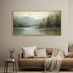 a living room with a couch and painting on the wall