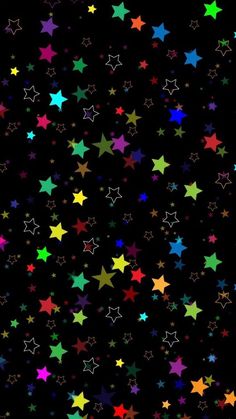 many different colored stars on a black background