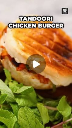 a sandwich with lettuce and tomato sauce on it is shown in this video