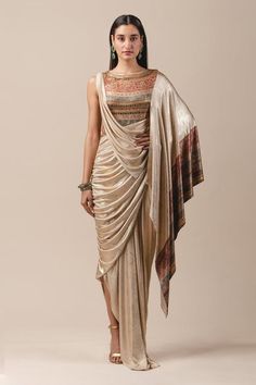 Red metallic foil jersey draped saree gown with sheer back panel, printed and embroidered detail.
Component: 1
Embroidered, Printed
Neckline: Round
Fabric: Foil Jersey
Color: Red
Pre-draped saree
Closure: Back zip - Aza Fashions Draped Saree Gown, Saree Gowns, Draped Saree, Drape Gowns, Draping Fashion, Saree Gown, Drape Saree, Red Foil, Tarun Tahiliani