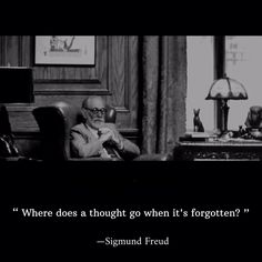 a man sitting in a chair next to a desk with a quote on it that says, where does a thought go when it's forgotten?