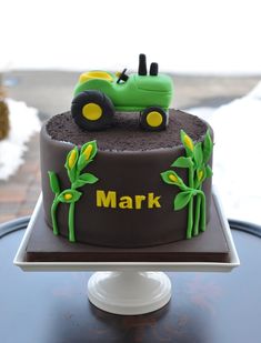 there is a cake with a tractor on it