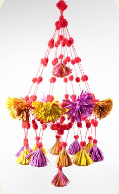 a multicolored chandelier with tassels hanging from it