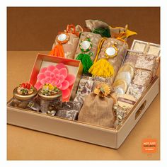 a box filled with assorted items on top of a table