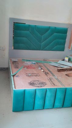 the bed is being built and ready to be used as a room divider or headboard