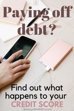 someone using their cell phone to pay off debt with the text, find out what happens to your credit score