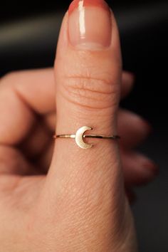 Dive into the celestial charm of our Moon Ring! The lunar-inspired design features a dainty moon on a simple, textured band - providing an adorable accent to any stack. The band measures approximately 1mm in width and features a lightly hammered finish. The moon detail measures approximately 6mm in width. This listing is for ONE SINGLE Moon Ring in 14K GOLD FILL metal. This ring is a great alternative to a stacking ring and is a perfect ring to mix and match with your favorite stacking rings. Every piece is organic and unique — no two Hannah Naomi pieces are exactly alike.Hand-crafted to order in our Portland, OR studio. Gold Ring Designs, Golden Ring, Moon Ring, Rings Simple, Stacking Ring, Perfect Ring, Stacking Rings, Ring Designs, Gold Ring