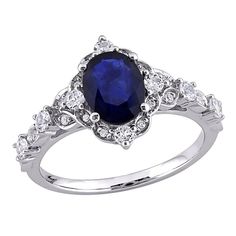 an oval blue sapphire and diamond ring