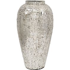 a white vase that has some kind of mosaic design on the front and side of it